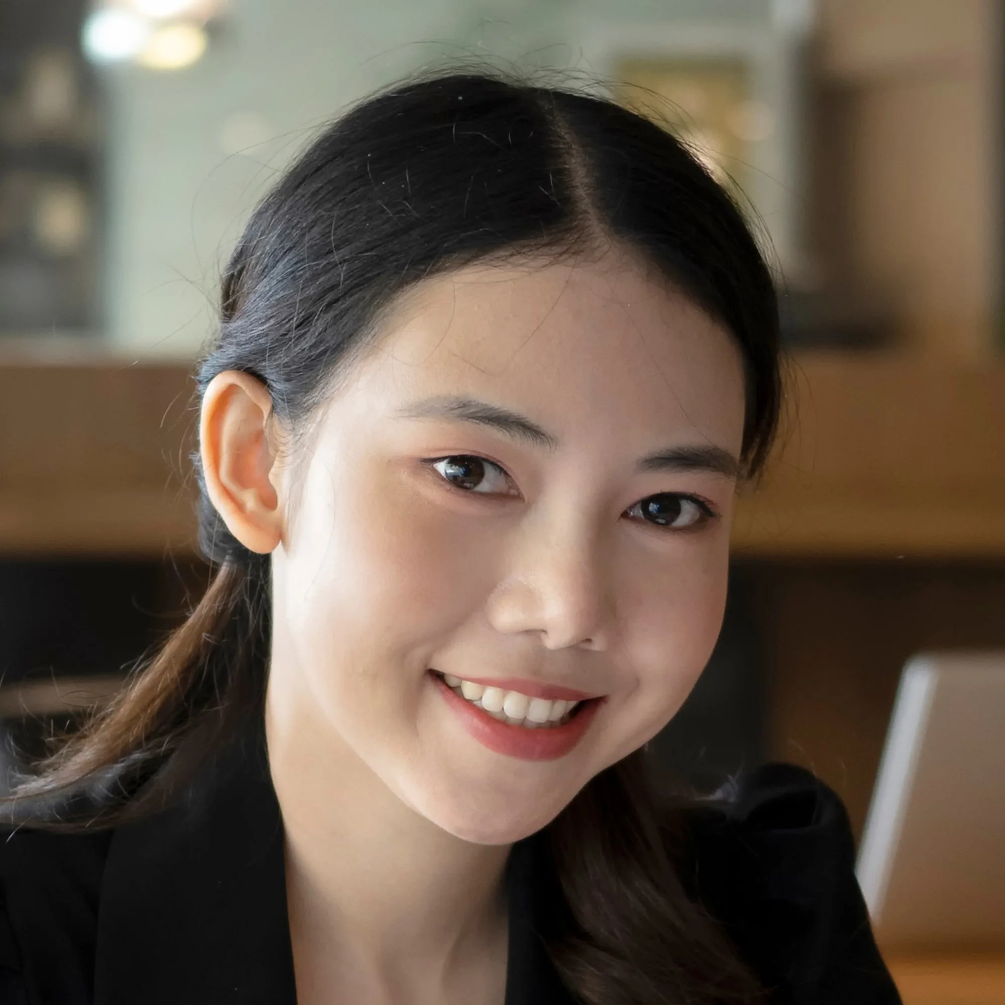 portrait-of-confident-businesswoman-holding-digita-Y6WTNXB.jpg