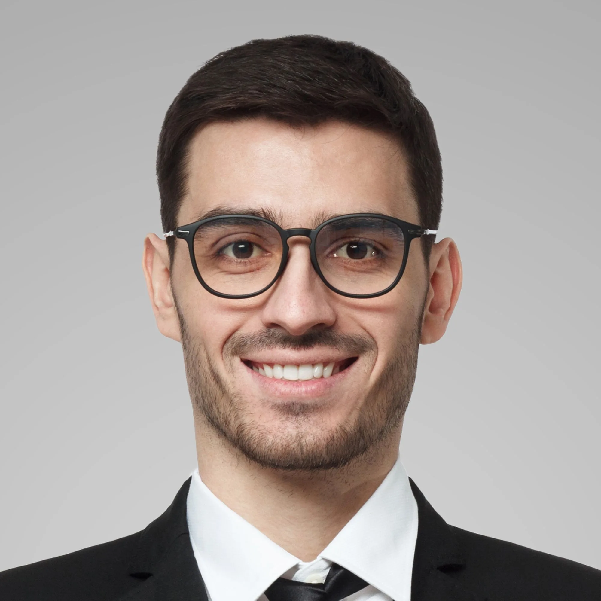portrait-of-smiling-handsome-business-man-standing-LY9NLSY.jpg